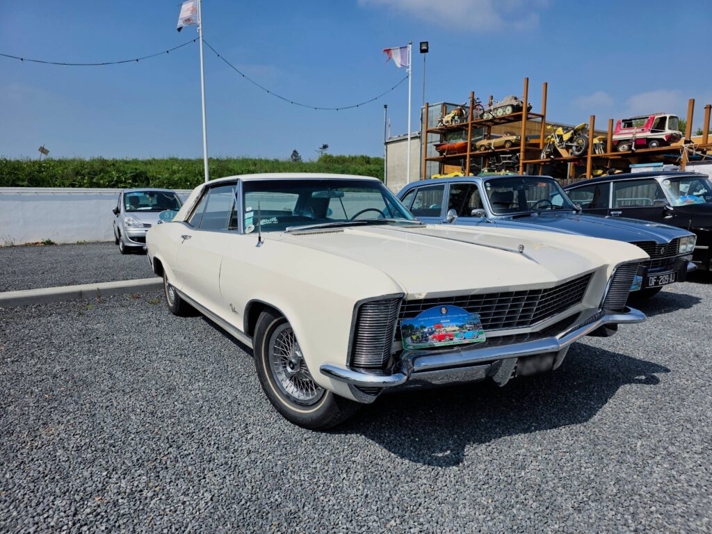 a white car parked in a parking lot